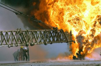 030328-M-0000X-005.Southern Iraq (Mar. 27, 2003) -- Kuwaiti firefighters fight an oil blaze at the Rumaila Oilfield as part of their ongoing support of Operation Iraqi Freedom, the multi-national coalition effort to liberate the Iraqi people, eliminate Iraqi's weapons of mass destruction, and end the regime of Saddam Hussein. U.S. Marine Corps photo by Pfc. Mary Rose Xenikakis. (RELEASED) .