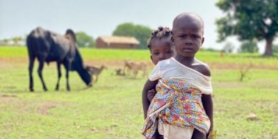 A-girl-carries-her-young-sister-in-Koumassi-Togo-600x800